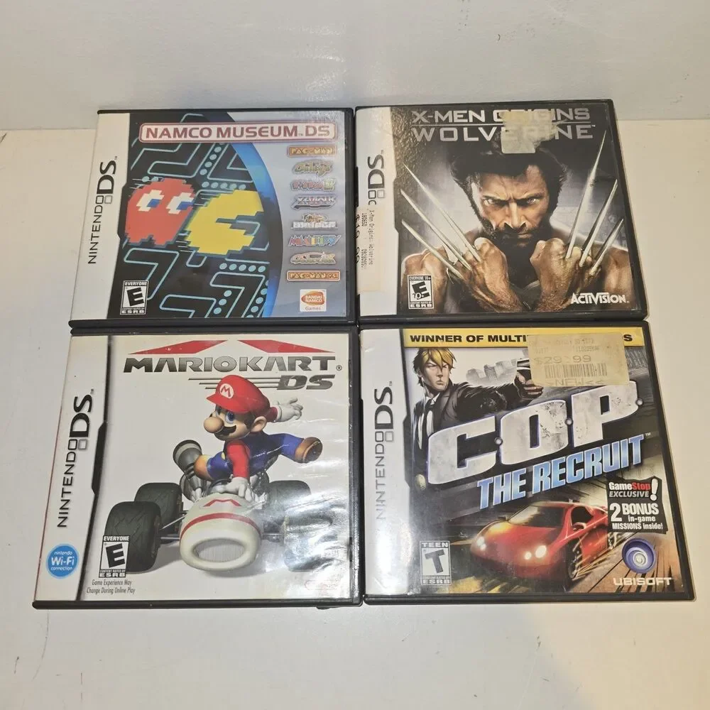 LOT OF 4 NINTENDO DS CASES AND MANUALS ONLY - NO GAMES. Mariokart Wolverine